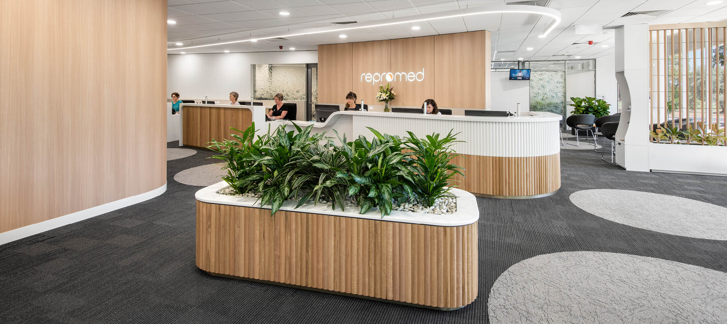 Natural Tones & Textures Add Enveloping Warmth to Repromed Fertility Clinic